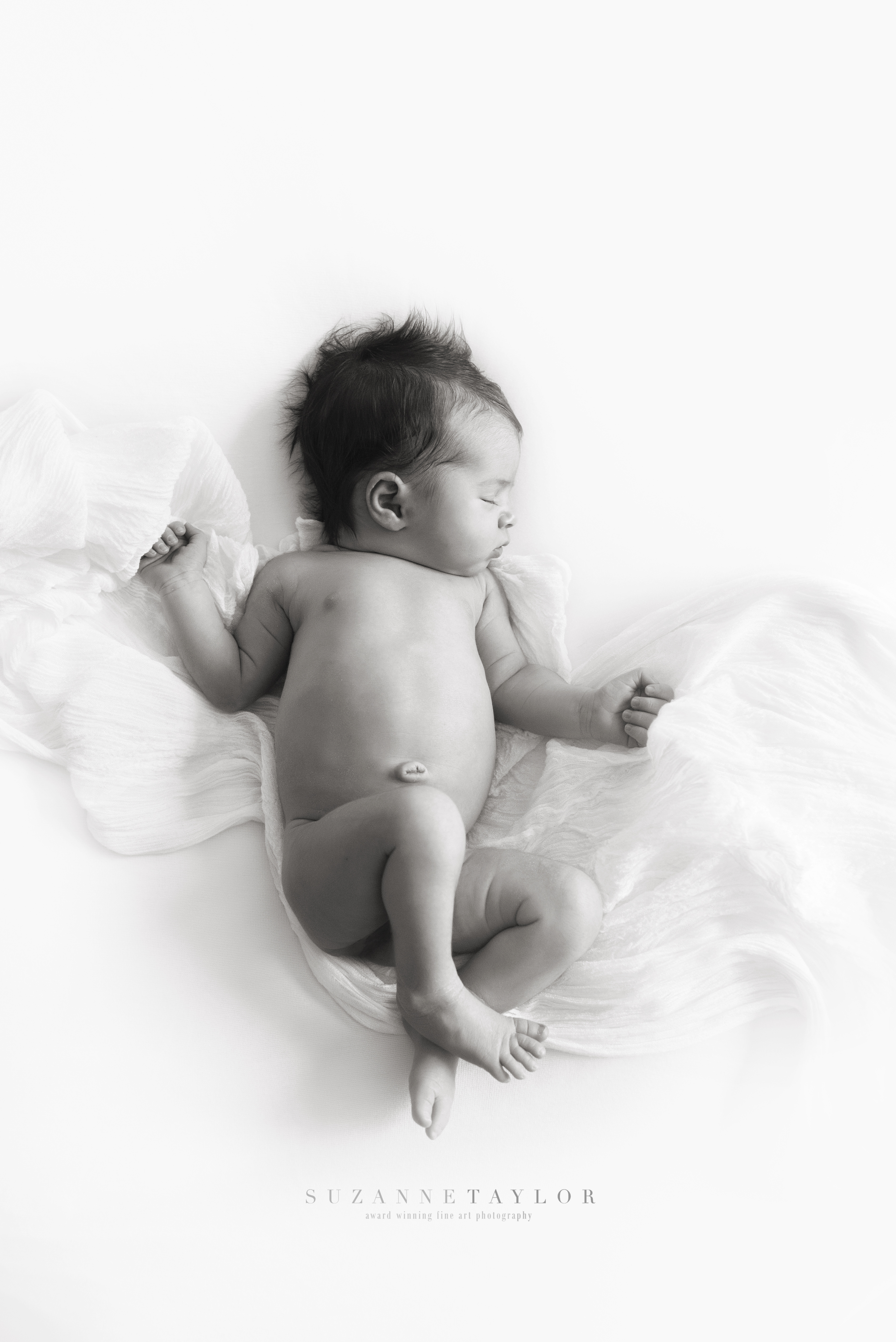 Newborn Photography in Calgary by Suzanne Taylor Photography is one of the most important things to book while expecting.